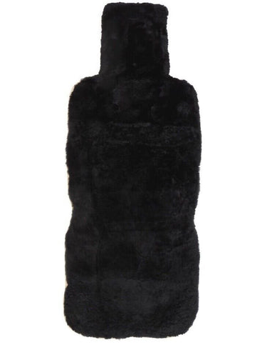 An Eastern Counties black sheepskin hot water bottle on a white background.