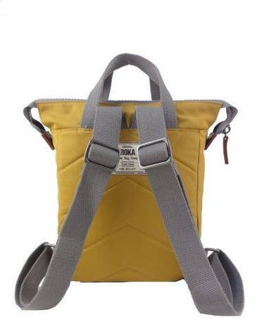 A small yellow Roka Bantry B Small Sustainable Nylon Bag with grey straps from Roka London Bags.