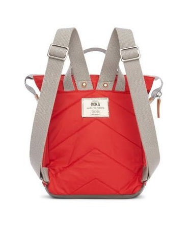 A weather-resistant Roka Bantry B Small Sustainable Nylon Bag in red and grey by Roka London Bags.
