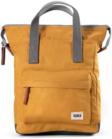 A weather-resistant yellow Roka Bantry B Small Sustainable Nylon Bag with a gray handle by Roka London Bags.