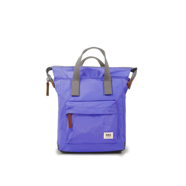A purple Roka Bantry B Small Sustainable Nylon bag with a brown handle by Roka London Bags.