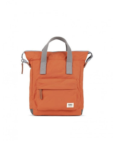 An Roka Bantry B Small Sustainable Nylon Bag in orange with grey handles by Roka London Bags.