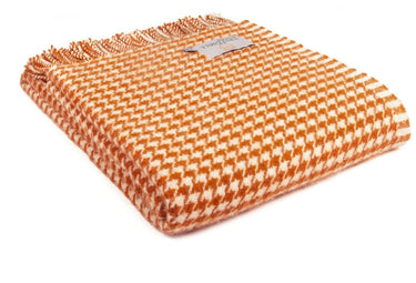An orange Tweedmill Houndstooth Wool Throw in various colours by Tweedmill Textiles.