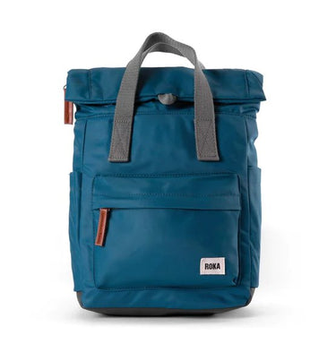 A weather-resistant Roka London Bags blue bag with a grey handle.