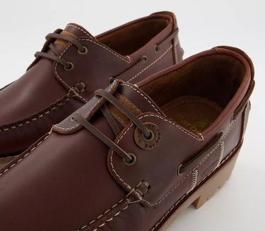 A pair of *Barbour Stern Boat Shoes - Mahogany* brown shoes.