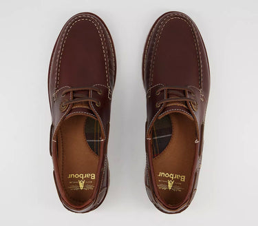 A pair of **Barbour Stern Boat Shoes - Mahogany** with **lacing details**.