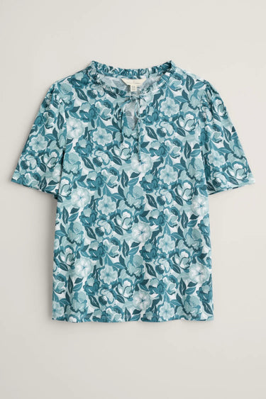 A Seasalt Anchor Hold Jersey Top in teal floral print with a v-neck and short sleeves made from bamboo-derived viscose fabric.
