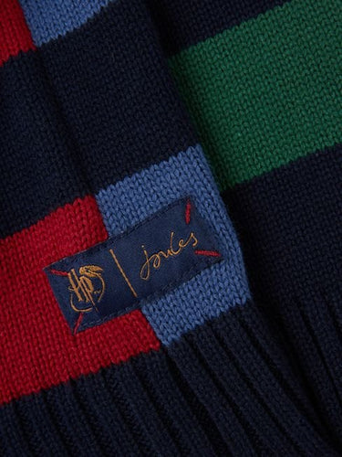 A close up of a Joules Hogwarts™ Red Harry Potter™ Striped Jumper with a logo on it.