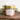 Toasted CrumpetThe Palace Gardens Candle in a Matt Gold Tin
