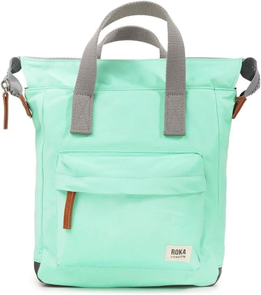 A sustainable Roka Bantry B Small Sustainable Nylon Bag in mint green with grey straps.