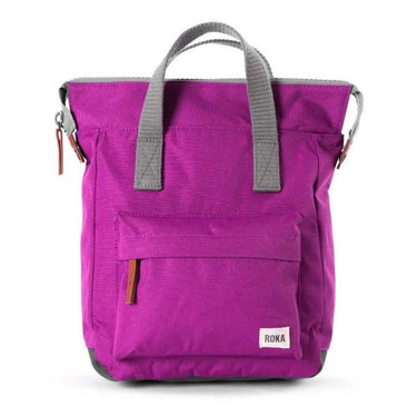 A purple Roka Bantry B Small Sustainable Nylon Bag with a grey handle from Roka London Bags.
